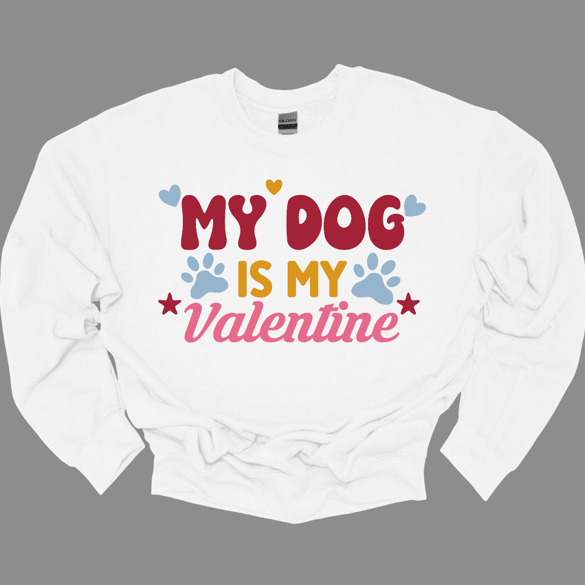 Declare your furry love story with our 'My Dog is My Valentine' T-shirt. This charming tee is a perfect expression of the deep bond between you and your canine companion. The heartfelt message takes center stage, surrounded by paw prints, capturing the unconditional love and loyalty that only a dog can offer. Shop at Gorgeousware.com today!