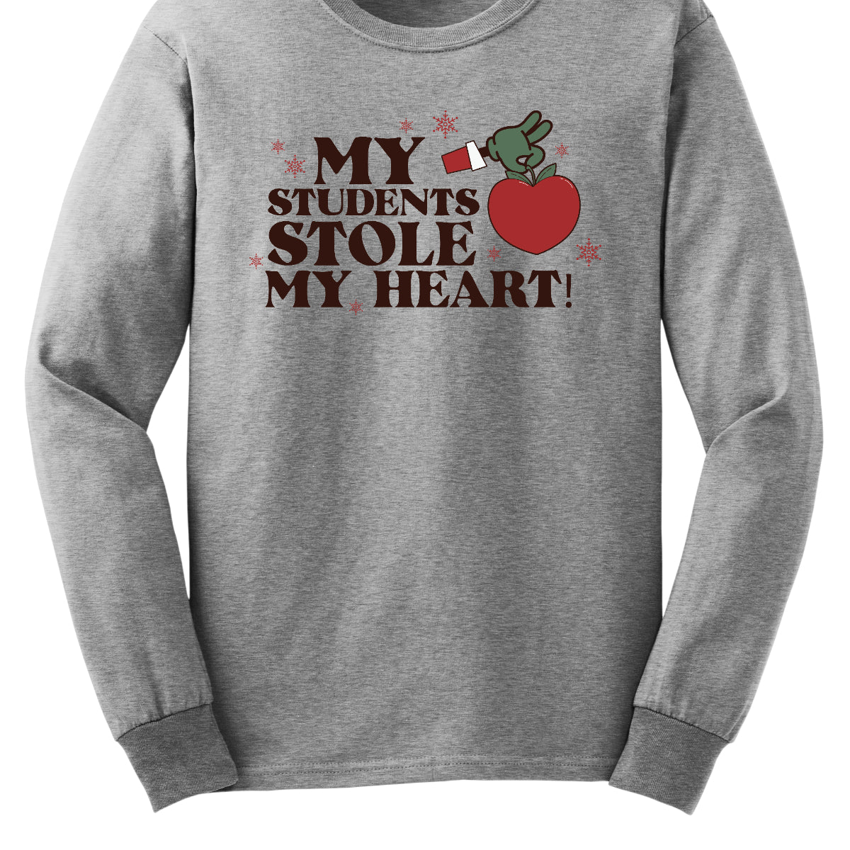 This playful t-shirt features the phrase "My students stole my heart" in fun, whimsical lettering that captures the spirit of teaching. Below the text, a cheeky illustration of the Grinch's green arm emerges, playfully grasping a shiny red apple, symbolizing knowledge and education. Shop at Gorgeousware.com