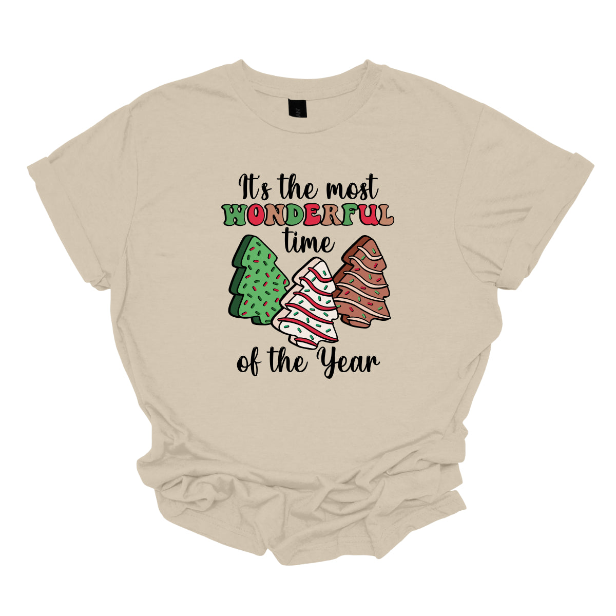 This festive t-shirt features the phrase "It's the most wonderful time of the year" in a stylish black cursive font, creating an elegant backdrop for the holiday message. The word "wonderful" stands out in a playful bubbly font that alternates between vibrant green, cheerful red, and warm brown, adding a whimsical touch. Shop Gorgeousware.com