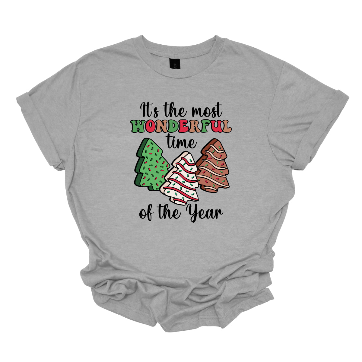 This festive t-shirt features the phrase "It's the most wonderful time of the year" in a stylish black cursive font, creating an elegant backdrop for the holiday message. The word "wonderful" stands out in a playful bubbly font that alternates between vibrant green, cheerful red, and warm brown, adding a whimsical touch. Shop Gorgeousware.com