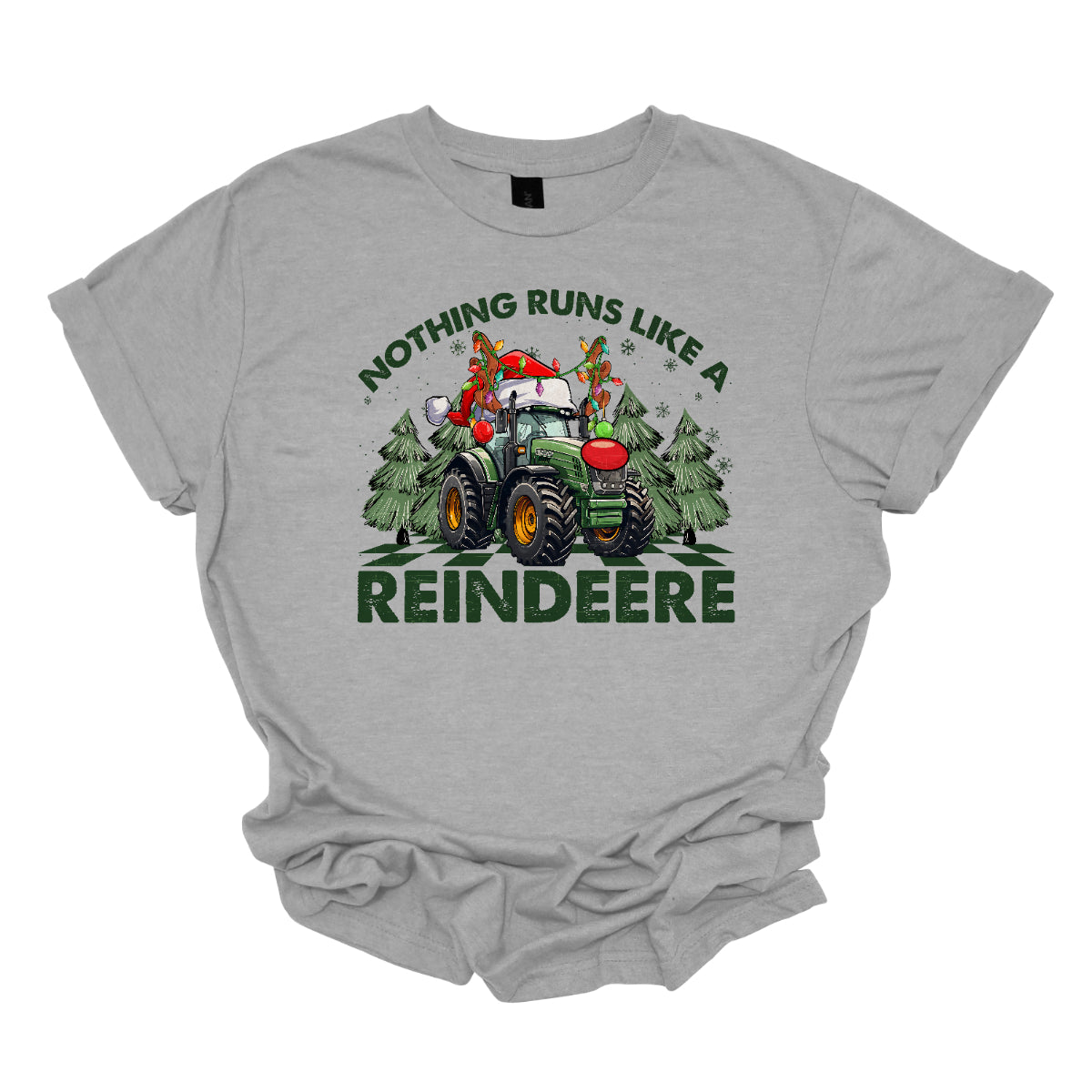 This playful t-shirt features the catchy phrase "Nothing runs like a reindeer" in bold black font, making a fun statement that’s perfect for the holiday season. At the center of the shirt, a charming John Deere tractor is decked out for Christmas: it sports a bright red nose, festive antlers, and a classic Santa hat, creating a delightful and humorous twist. The tractor is surrounded by whimsical Christmas trees, adding a cheerful backdrop that enhances the festive vibe. Shop Gorgeousware.com