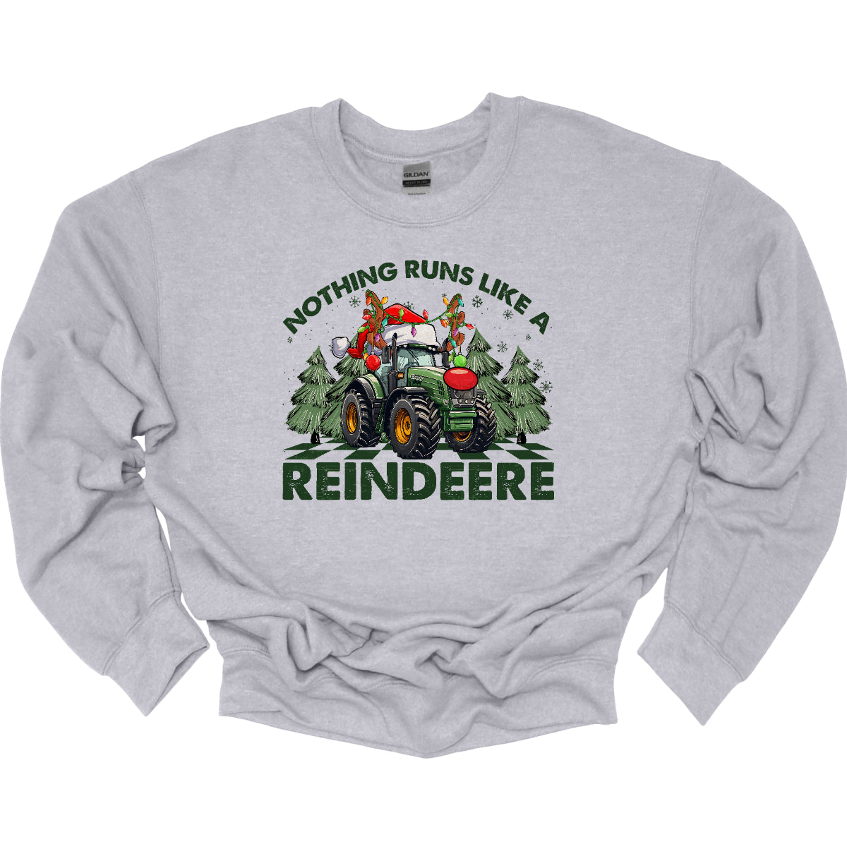 This playful t-shirt features the catchy phrase "Nothing runs like a reindeer" in bold black font, making a fun statement that’s perfect for the holiday season. At the center of the shirt, a charming John Deere tractor is decked out for Christmas: it sports a bright red nose, festive antlers, and a classic Santa hat, creating a delightful and humorous twist. The tractor is surrounded by whimsical Christmas trees, adding a cheerful backdrop that enhances the festive vibe. Shop Gorgeousware.com
