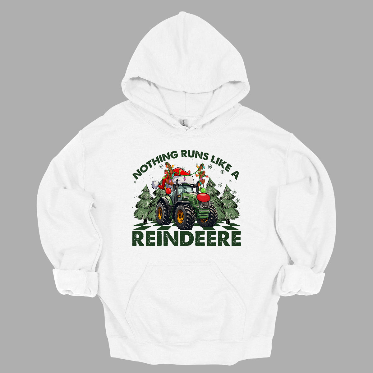 This playful t-shirt features the catchy phrase "Nothing runs like a reindeer" in bold black font, making a fun statement that’s perfect for the holiday season. At the center of the shirt, a charming John Deere tractor is decked out for Christmas: it sports a bright red nose, festive antlers, and a classic Santa hat, creating a delightful and humorous twist. The tractor is surrounded by whimsical Christmas trees, adding a cheerful backdrop that enhances the festive vibe. Shop Gorgeousware.com