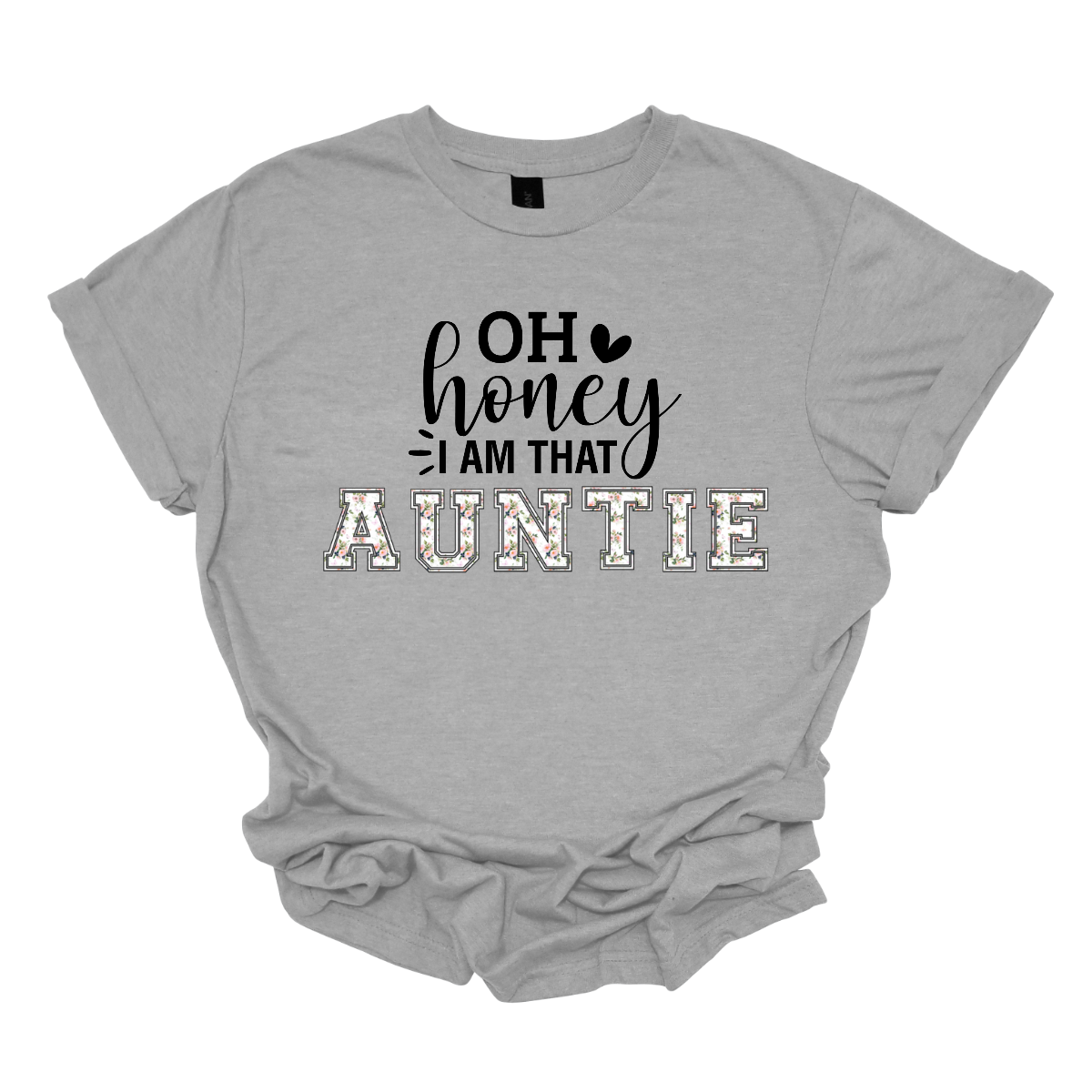 The shirt design features the phrase "Oh Honey, I'm That Auntie" in a playful and eye-catching style. The word "Auntie" is written in bold, bubbly letters filled with intricate floral patterns, giving it a soft and feminine touch. The rest of the phrase uses a mix of fun, whimsical fonts to create a lively and energetic feel. The design is perfect for a stylish and confident auntie who loves to embrace her role with charm and humor. Shop Gorgeouseware.com