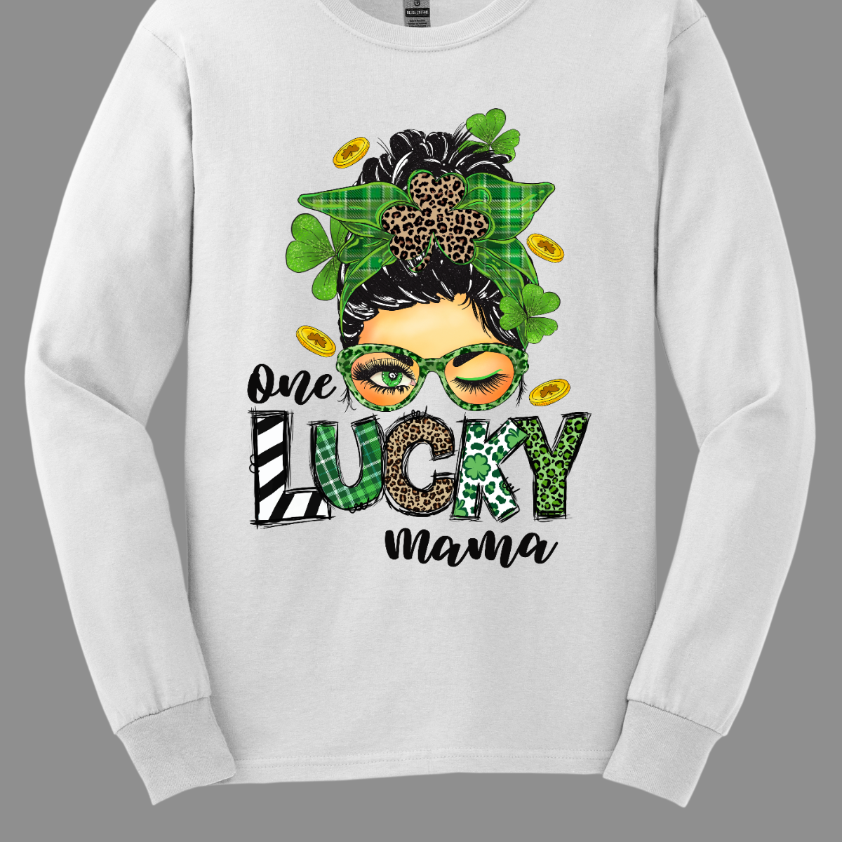 Embrace your mom pride with our charming "One Lucky Mama" T-shirt! This adorable design features a whimsical illustration of a mom sporting a messy updo and trendy green glasses, exuding a fun and carefree vibe. Celebrate the joy of motherhood in style with our "One Lucky Mama" T-shirt. It's a must-have addition to your wardrobe and also makes a thoughtful gift for any proud mama in your life. Wear it with pride and let the world know just how lucky you feel to be a mom! Shop at Gorgeousware.com