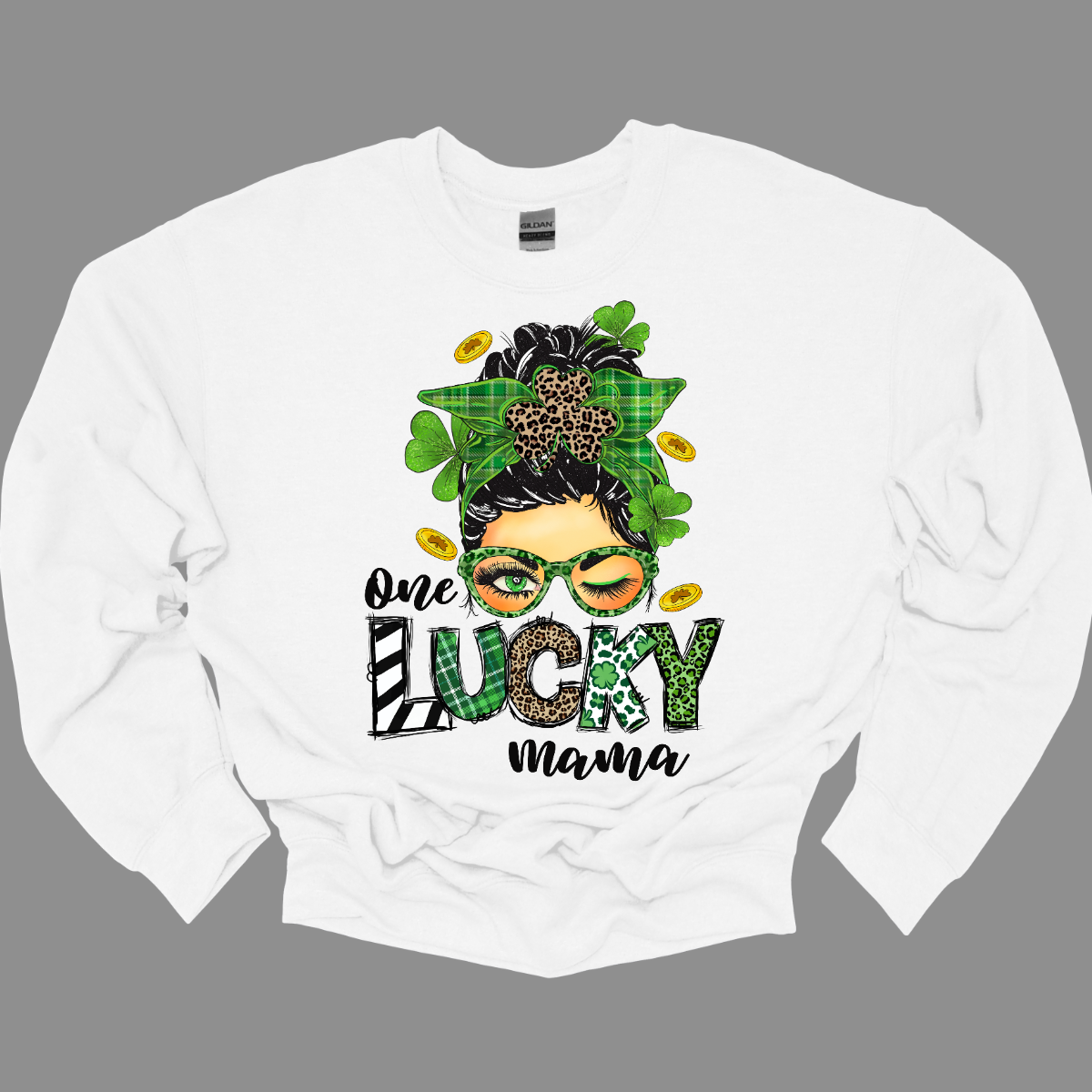 Embrace your mom pride with our charming "One Lucky Mama" T-shirt! This adorable design features a whimsical illustration of a mom sporting a messy updo and trendy green glasses, exuding a fun and carefree vibe. Celebrate the joy of motherhood in style with our "One Lucky Mama" T-shirt. It's a must-have addition to your wardrobe and also makes a thoughtful gift for any proud mama in your life. Wear it with pride and let the world know just how lucky you feel to be a mom! Shop at Gorgeousware.com