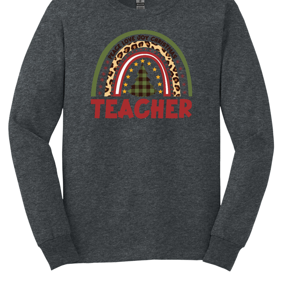 The t-shirt design features a vibrant, patterned rainbow that arcs gracefully across the fabric. Each color of the rainbow is adorned with playful patterns, such as polka dots, snowflakes, and cheetah print, adding a whimsical touch. At the center of the rainbow stands a beautifully illustrated Christmas tree. Shop at orgeousware.com