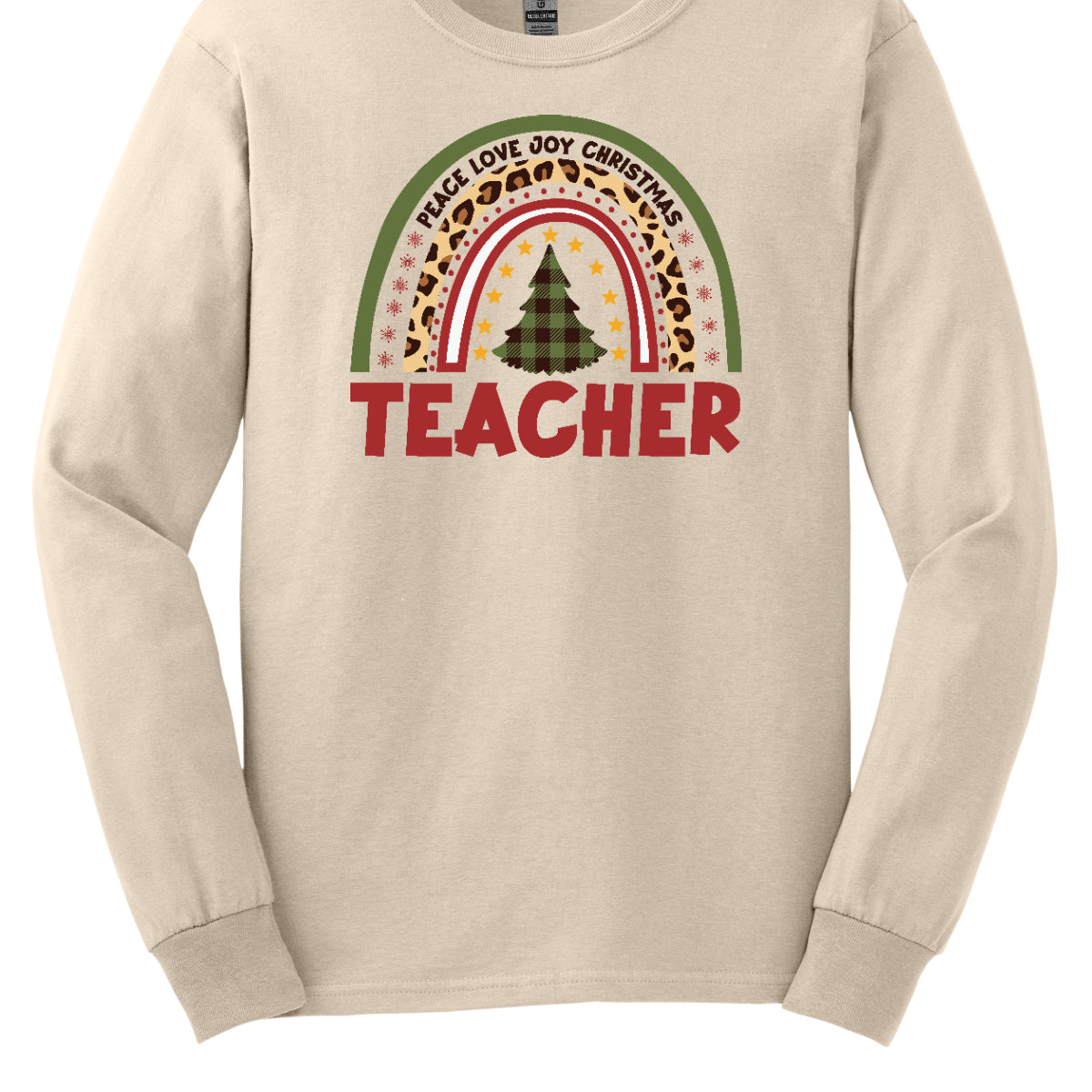 The t-shirt design features a vibrant, patterned rainbow that arcs gracefully across the fabric. Each color of the rainbow is adorned with playful patterns, such as polka dots, snowflakes, and cheetah print, adding a whimsical touch. At the center of the rainbow stands a beautifully illustrated Christmas tree. Shop at orgeousware.com