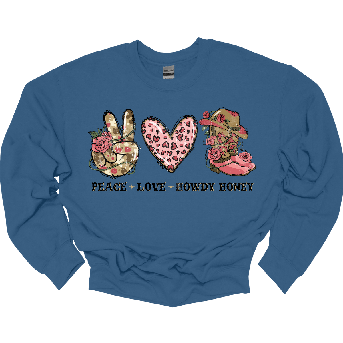 Introducing our "Peace, Love, Howdy Honey" T-shirt – a delightful and charming garment that beautifully combines messages of peace and love with a touch of Western flair. This shirt features a hand showing the peace sign, a heart, and iconic cowgirl boots adorned with a stylish cowgirl hat sitting on top. Shop at Gorgesouware.com