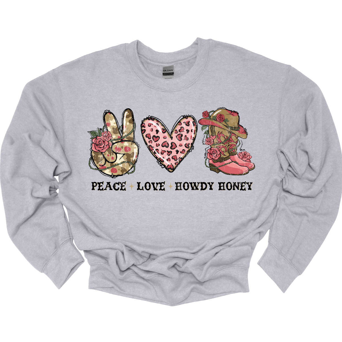 Introducing our "Peace, Love, Howdy Honey" T-shirt – a delightful and charming garment that beautifully combines messages of peace and love with a touch of Western flair. This shirt features a hand showing the peace sign, a heart, and iconic cowgirl boots adorned with a stylish cowgirl hat sitting on top. Shop at Gorgesouware.com