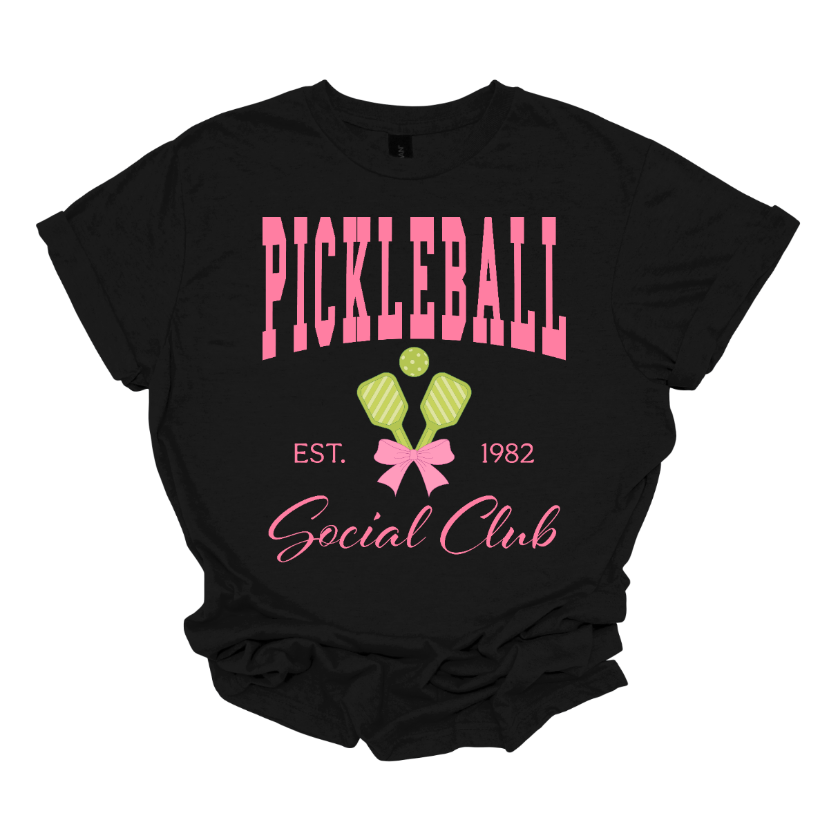 The shirt design features the phrase "Pickleball Social Club" in bold, hot pink font, giving it a fun and vibrant look. Below, "Est. 1982" is displayed in a stylish, slightly smaller font, adding a touch of vintage charm.
Two pickleball paddles are crossed in the center, creating a dynamic focal point, with a pickleball placed between them to emphasize the sport. A pink bow is tied around the intersection of the paddles, adding a playful and fashionable touch. Shop Gorgeousware.com