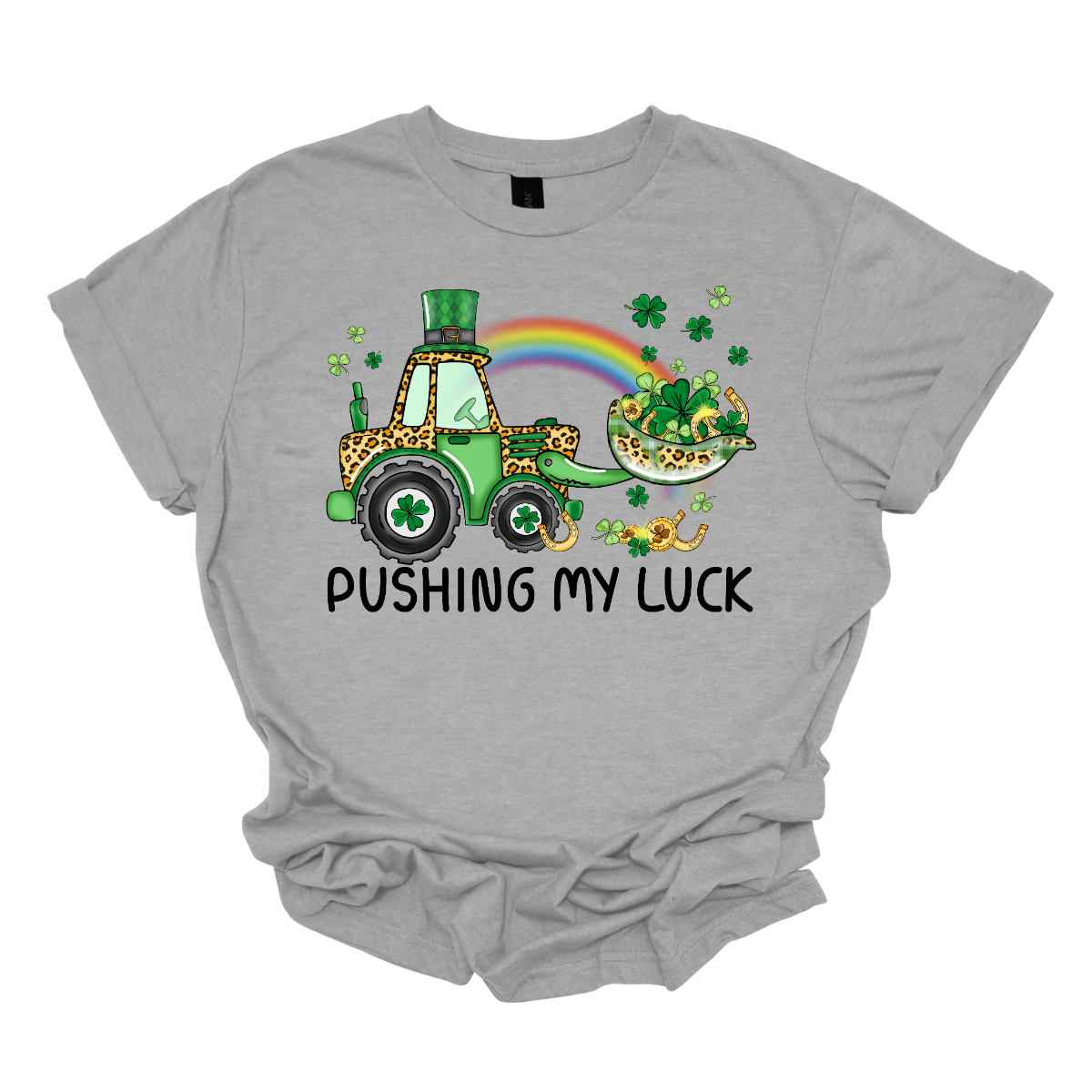 A playful and whimsical garment that captures the spirit of the holiday with a touch of fun. This shirt features a lively design with a tractor playfully shoveling a load of shamrocks, creating a unique and charming representation of pushing one's luck in a St. Patrick's Day context. The design showcases a tractor adorned with shamrocks, symbolizing the act of "pushing" luck in a light-hearted and festive manner. Shop at Gorgeousware.com