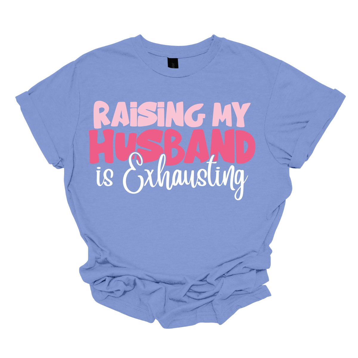 This T-shirt features the humorous phrase "Raising My Husband Is Exhausting" prominently across the chest. The text is creatively arranged in a mix of playful and quirky fonts, each each line standing out with a unique style. The color palette is a soft and vibrant pink, with a varying shade to enhance the fun and lighthearted vibe of the design. Shop at Gorgeousware.com