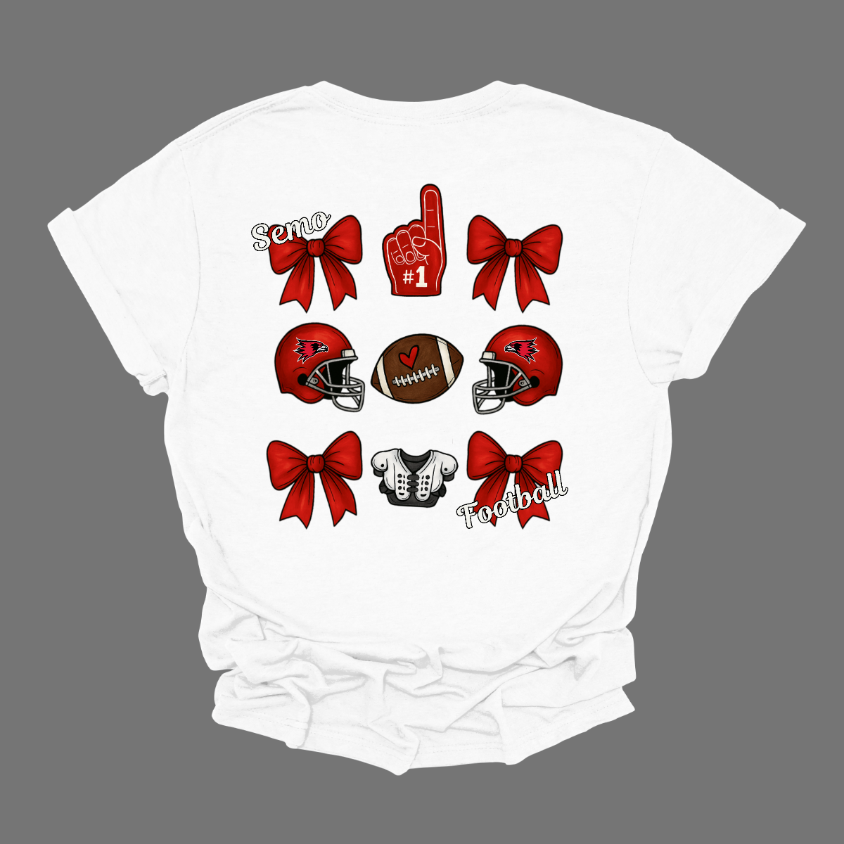This SEMO Football Bow Grid design is available in short and long sleeve options.
Front Design: A chic red croquette bow sits on the upper left chest, accented with bold white “SEMO” lettering.
Back Design: A playful grid layout showcases an exciting mix of Redhawk game-day icons—red croquette bows, SEMO football helmets, sturdy shoulder pads, and the classic #1 foam hand—all celebrating SEMO’s winning spirit.
Shop at Gorgeousware.com today!