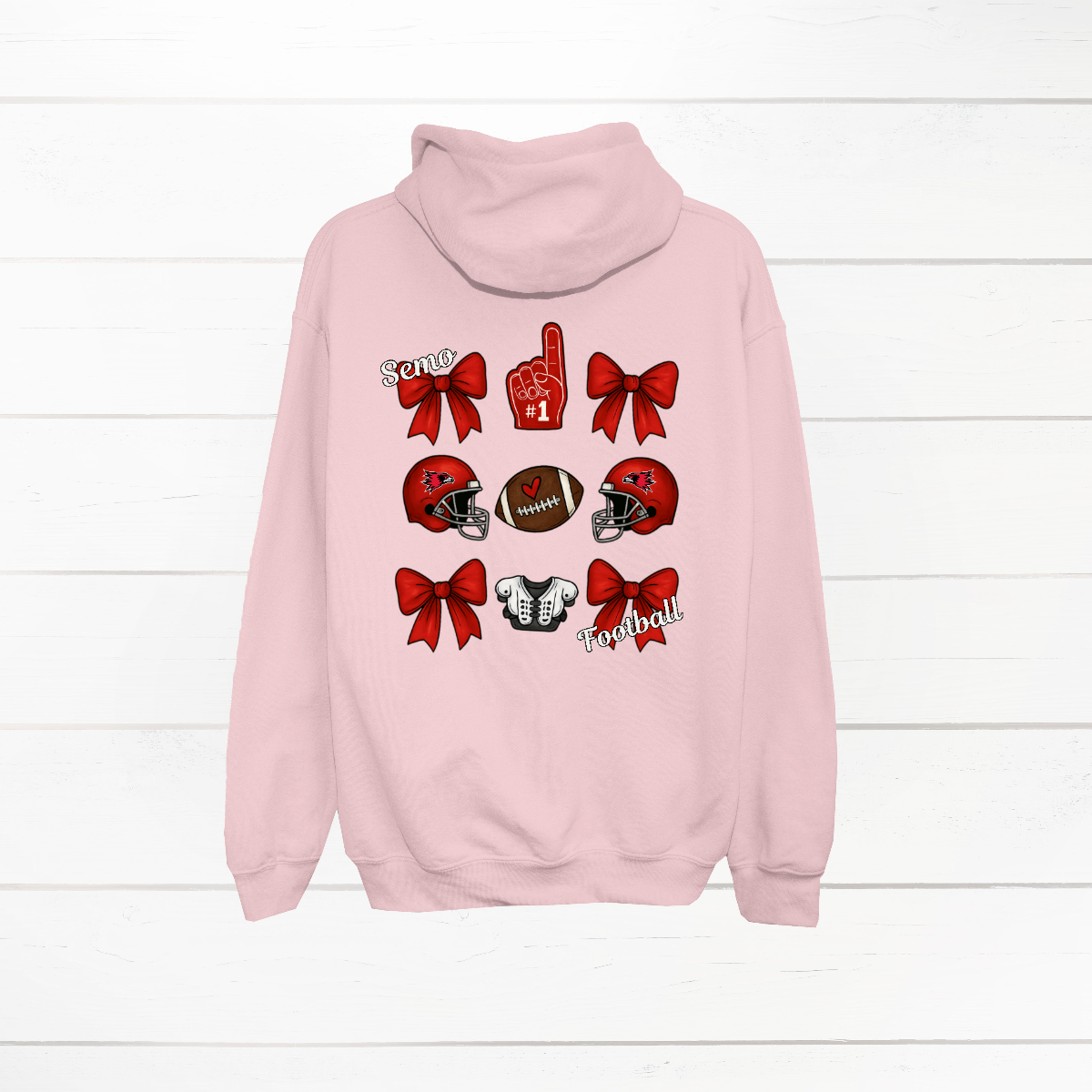 This SEMO Football Bow Grid design is available in youth sizes across short sleeve, long sleeve, crewneck, and hoodie options.
Front Design: A chic red croquette bow sits on the upper left chest, accented with bold white “SEMO” lettering.
Back Design: A playful grid layout showcases an exciting mix of Redhawk game-day icons—red croquette bows, SEMO football helmets, sturdy shoulder pads, and the classic #1 foam hand—all celebrating SEMO’s winning spirit.
Shop at Gorgeousware.com today!