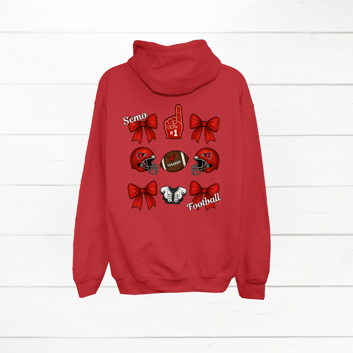 This SEMO Football Bow Grid design is available in youth sizes across short sleeve, long sleeve, crewneck, and hoodie options.
Front Design: A chic red croquette bow sits on the upper left chest, accented with bold white “SEMO” lettering.
Back Design: A playful grid layout showcases an exciting mix of Redhawk game-day icons—red croquette bows, SEMO football helmets, sturdy shoulder pads, and the classic #1 foam hand—all celebrating SEMO’s winning spirit.
Shop at Gorgeousware.com today!