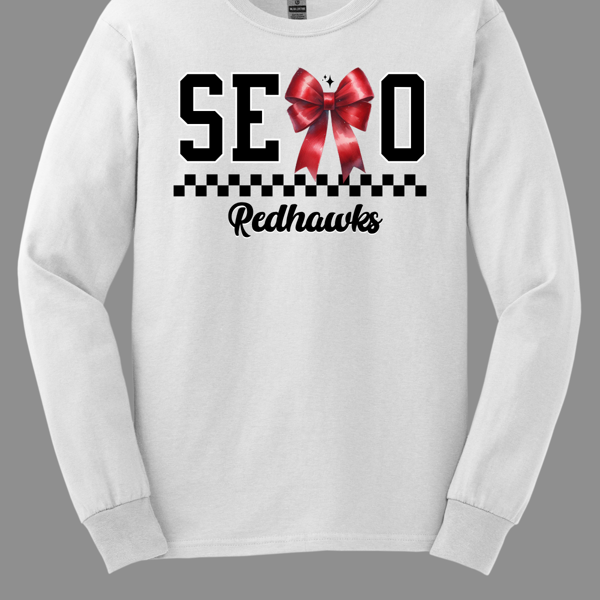 Show off your SEMO pride in style with this trendy apparel for youth! This shirt features bold letters” SEMO,” where the "M" is cleverly replaced by a stylish red croquette bow, this shirt adds a unique twist to your wardrobe. Underneath, a playful checkerboard stripe adds a fun touch, while "Redhawks" is elegantly written in a cute cursive font. Get ready to turn heads and express your school spirit! Shop at Gorgeousware.com today!