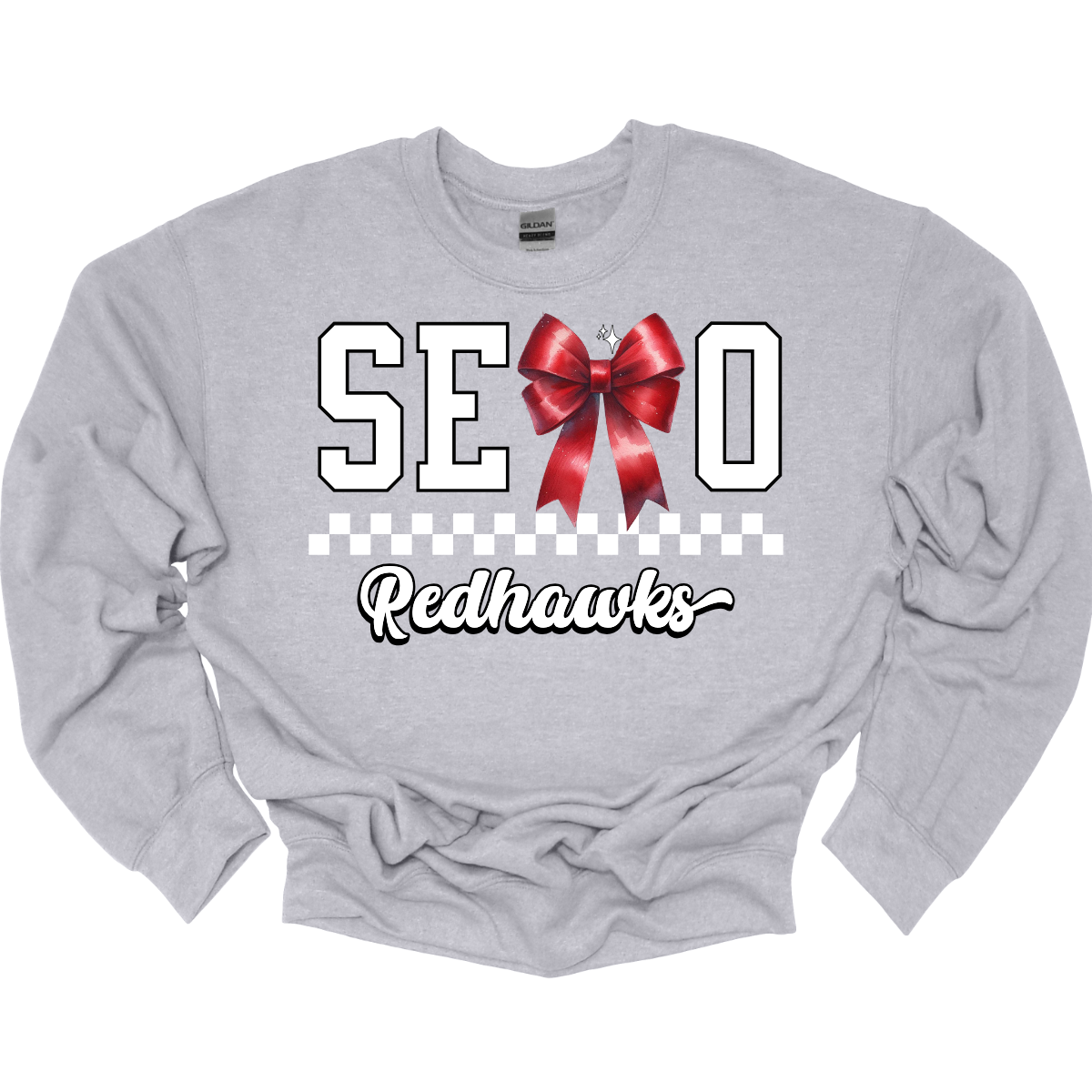 This SEMO crewneck features white lettering outlined in black with a creative twist - the letter "M" is a stylish red bow for a pop of color and school spirit. A classic checkerboard line runs through the center for a trendy, eye-catching look, while the design is completed with "Redhawks" in script underneath for the perfect final touch.
Shop at Gorgeousware.com today!