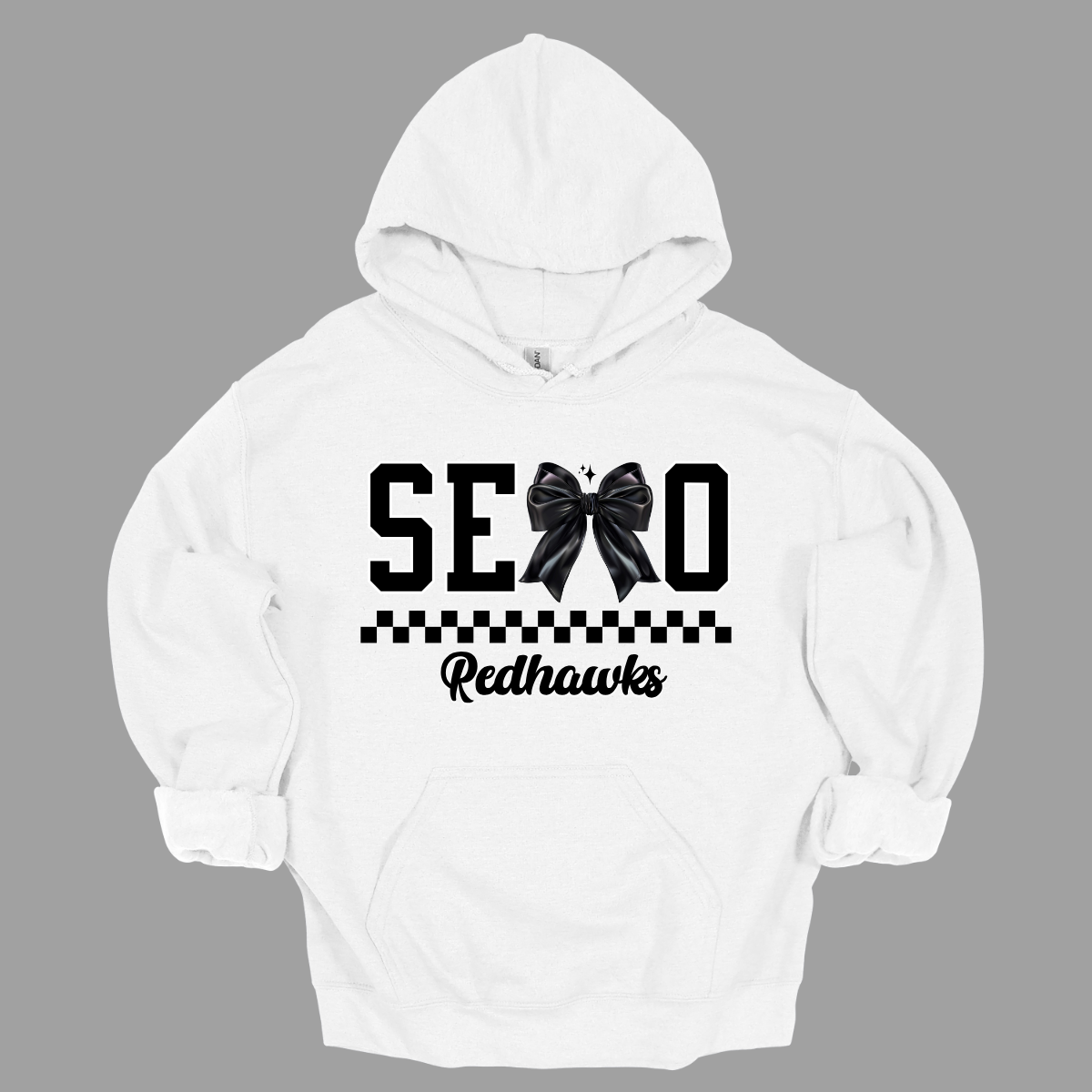 Show off your SEMO pride in style with this trendy creneck and hoodie! Featuring the bold letters "SEMO," where the "M" is cleverly replaced by a stylish black croquette bow, this shirt adds a unique twist to your wardrobe. Underneath, a playful checkerboard stripe adds a fun touch, while "Redhawks" is elegantly written in a cute cursive font, bringing a touch of flair. Shop at Gorgeousware.com