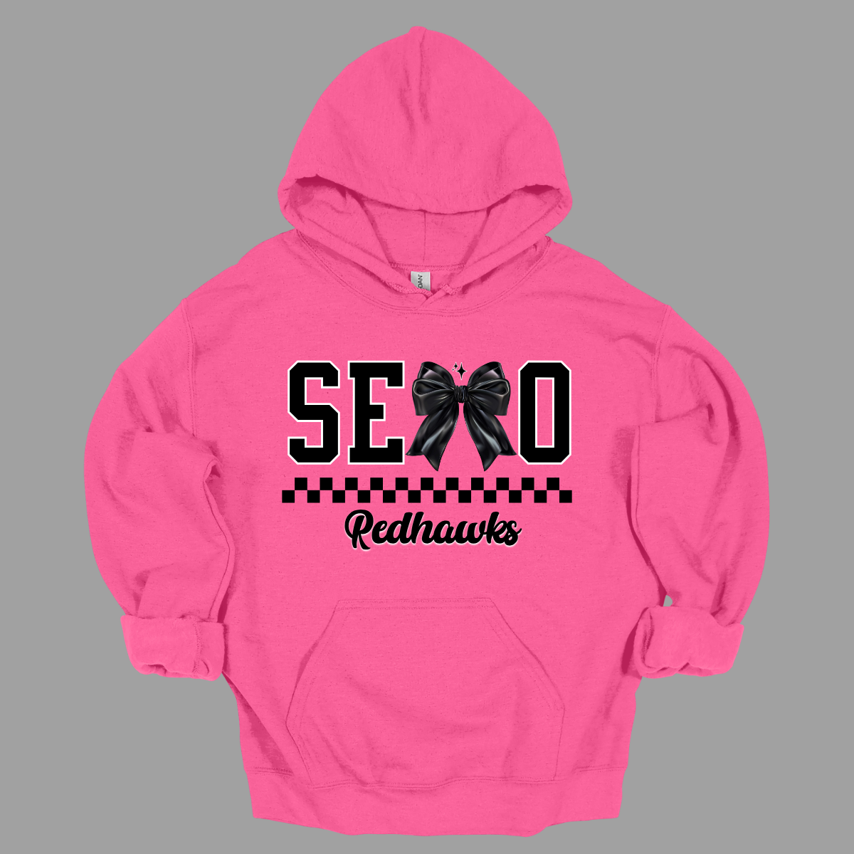 Show off your SEMO pride in style with this trendy creneck and hoodie! Featuring the bold letters "SEMO," where the "M" is cleverly replaced by a stylish black croquette bow, this shirt adds a unique twist to your wardrobe. Underneath, a playful checkerboard stripe adds a fun touch, while "Redhawks" is elegantly written in a cute cursive font, bringing a touch of flair. Shop at Gorgeousware.com