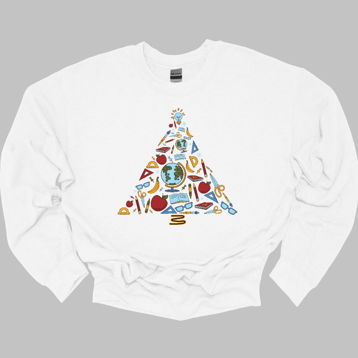 This creative t-shirt design features a festive Christmas tree composed entirely of colorful school supplies. Pencils, rulers, markers, and notebooks, and other school supplies form the branches adding a playful touch. The vibrant colors and unique arrangement create a fun and engaging visual, perfect for educators and students alike. Made from soft, comfortable fabric, this t-shirt is an ideal way to celebrate the holiday season while showcasing a love for learning!! Shop at Gorgeousware.com