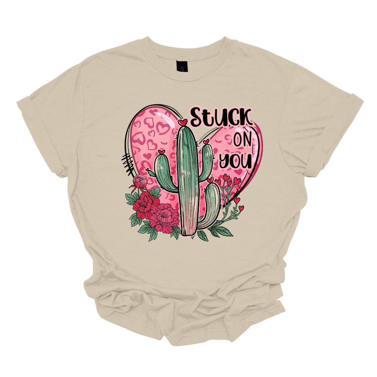 Introducing our "Stuck On You" T-shirt – a playful and charming garment that beautifully blends romance with a touch of desert whimsy. This shirt features an endearing heart entwined with a cactus, creating a delightful design that captures the essence of love with a hint of humor. Shop at Gorgeousware.com