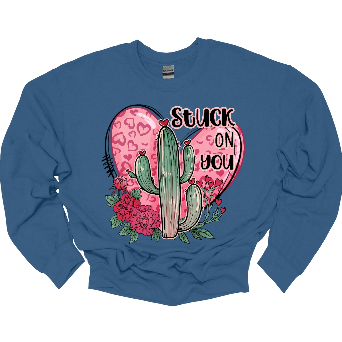 Introducing our "Stuck On You" T-shirt – a playful and charming garment that beautifully blends romance with a touch of desert whimsy. This shirt features an endearing heart entwined with a cactus, creating a delightful design that captures the essence of love with a hint of humor. Shop at Gorgeousware.com