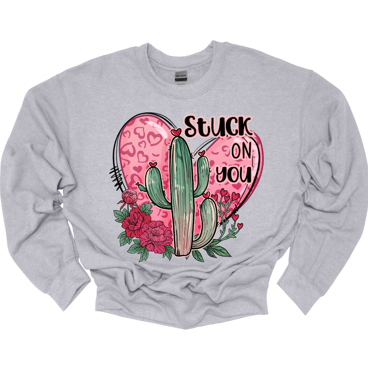 Introducing our "Stuck On You" T-shirt – a playful and charming garment that beautifully blends romance with a touch of desert whimsy. This shirt features an endearing heart entwined with a cactus, creating a delightful design that captures the essence of love with a hint of humor. Shop at Gorgeousware.com