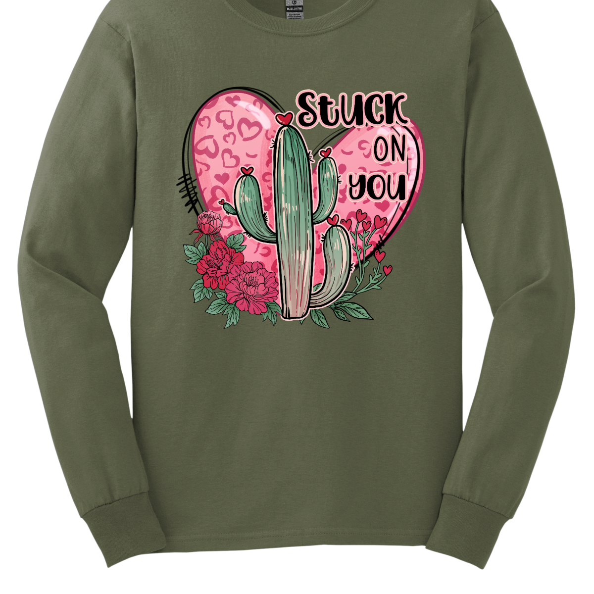 Introducing our "Stuck On You" T-shirt – a playful and charming garment that beautifully blends romance with a touch of desert whimsy. This shirt features an endearing heart entwined with a cactus, creating a delightful design that captures the essence of love with a hint of humor. Shop at Gorgeousware.com