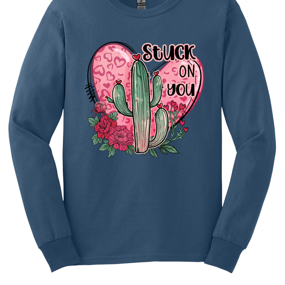 Introducing our "Stuck On You" T-shirt – a playful and charming garment that beautifully blends romance with a touch of desert whimsy. This shirt features an endearing heart entwined with a cactus, creating a delightful design that captures the essence of love with a hint of humor. Shop at Gorgeousware.com