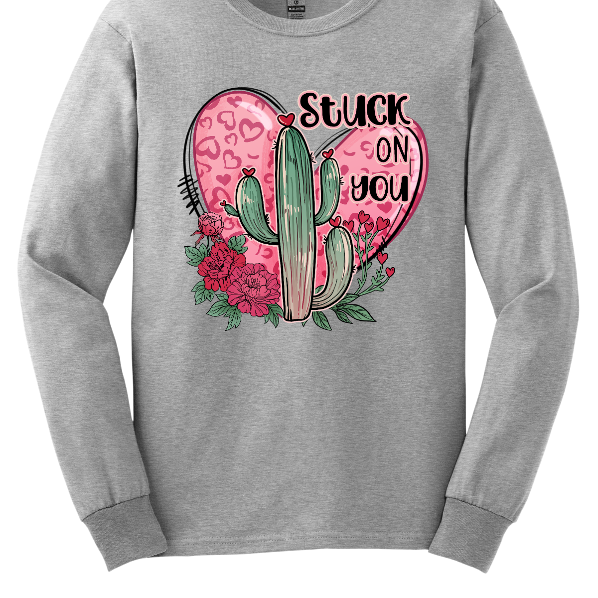 Introducing our "Stuck On You" T-shirt – a playful and charming garment that beautifully blends romance with a touch of desert whimsy. This shirt features an endearing heart entwined with a cactus, creating a delightful design that captures the essence of love with a hint of humor. Shop at Gorgeousware.com