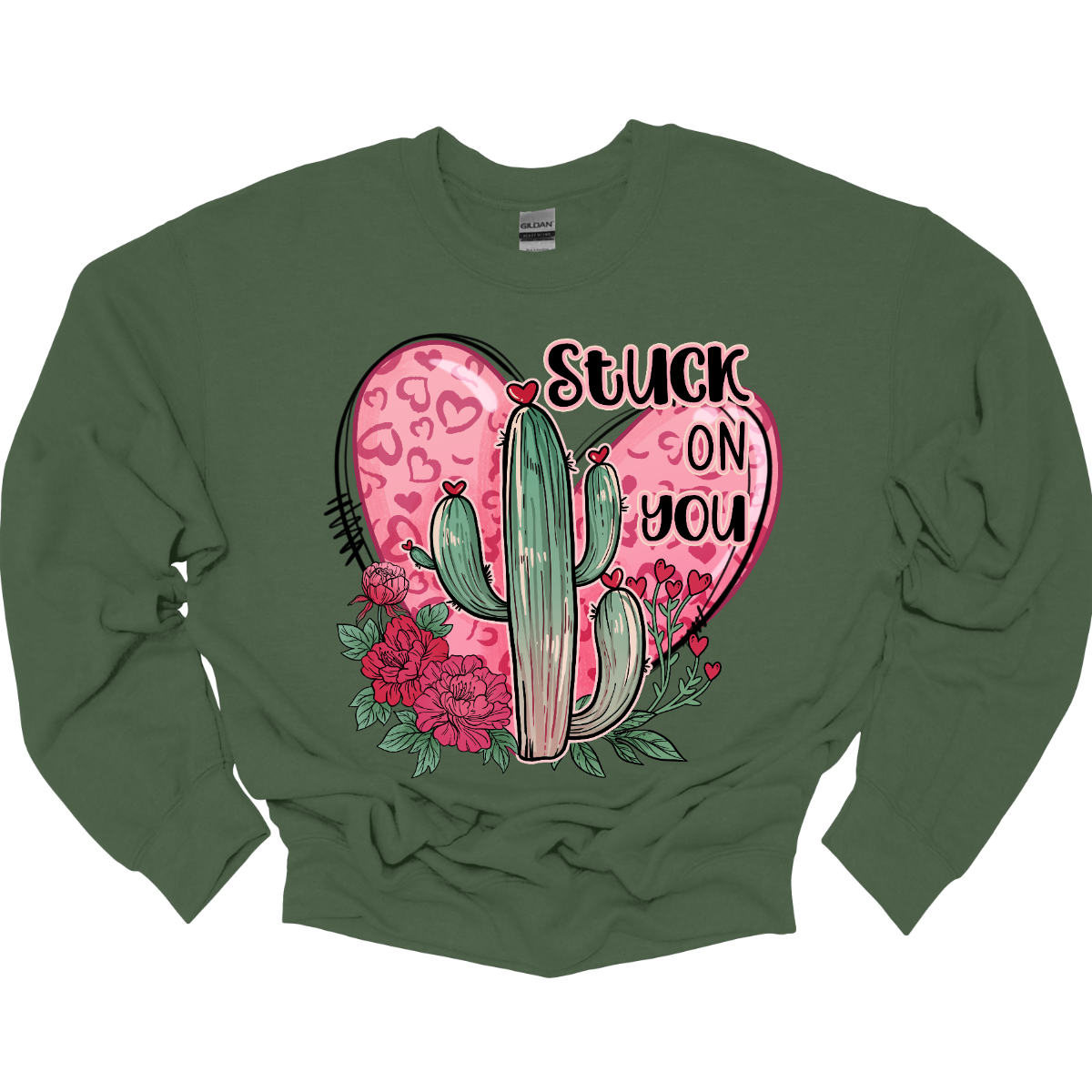 Introducing our "Stuck On You" T-shirt – a playful and charming garment that beautifully blends romance with a touch of desert whimsy. This shirt features an endearing heart entwined with a cactus, creating a delightful design that captures the essence of love with a hint of humor. Shop at Gorgeousware.com