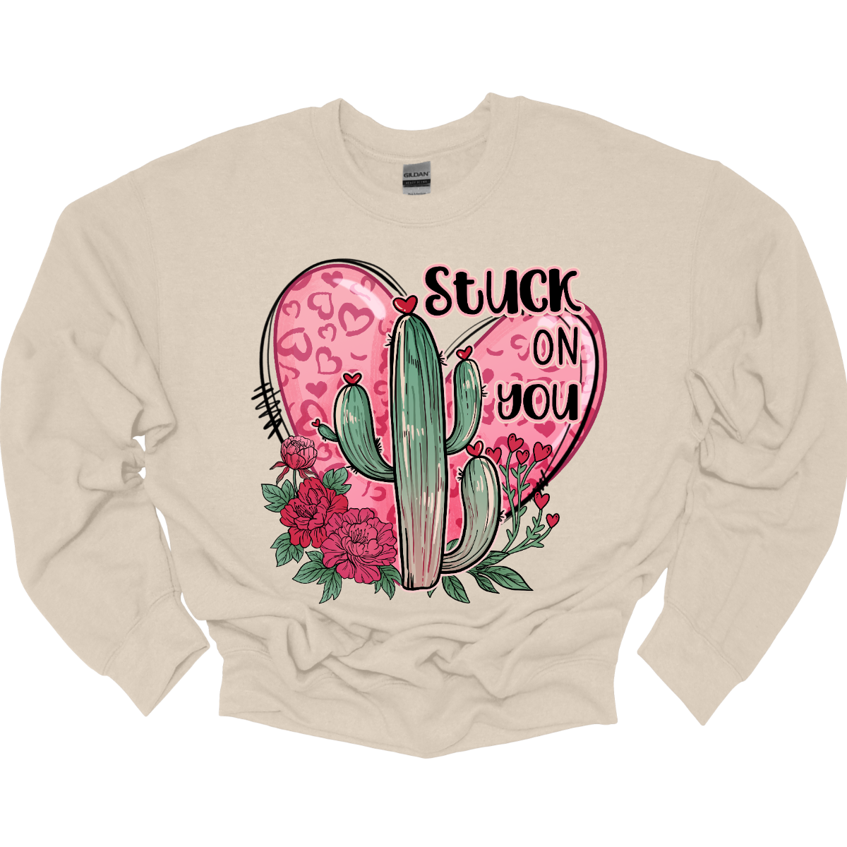 Introducing our "Stuck On You" T-shirt – a playful and charming garment that beautifully blends romance with a touch of desert whimsy. This shirt features an endearing heart entwined with a cactus, creating a delightful design that captures the essence of love with a hint of humor. Shop at Gorgeousware.com