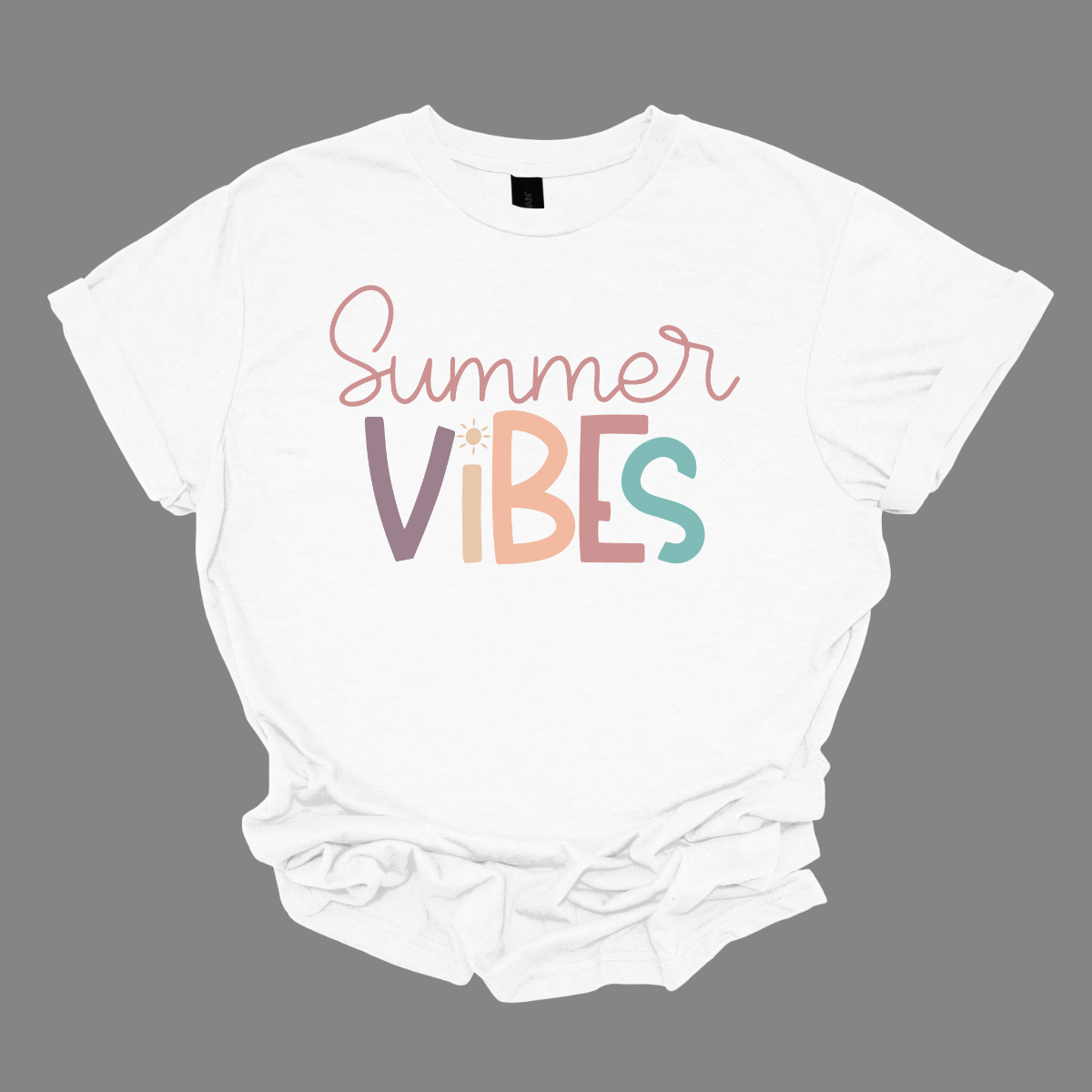 This shirt features the playful phrase "Summer Vibes" in a fun, vibrant font that immediately evokes a sense of warmth and relaxation. The letters are styled in soft pastel hues of purple, blue, pink, and coral, creating a cheerful and breezy vibe. The combination of these gentle, summery colors makes the design feel lighthearted and perfect for sunny days. Shop Gorgeouseware.com