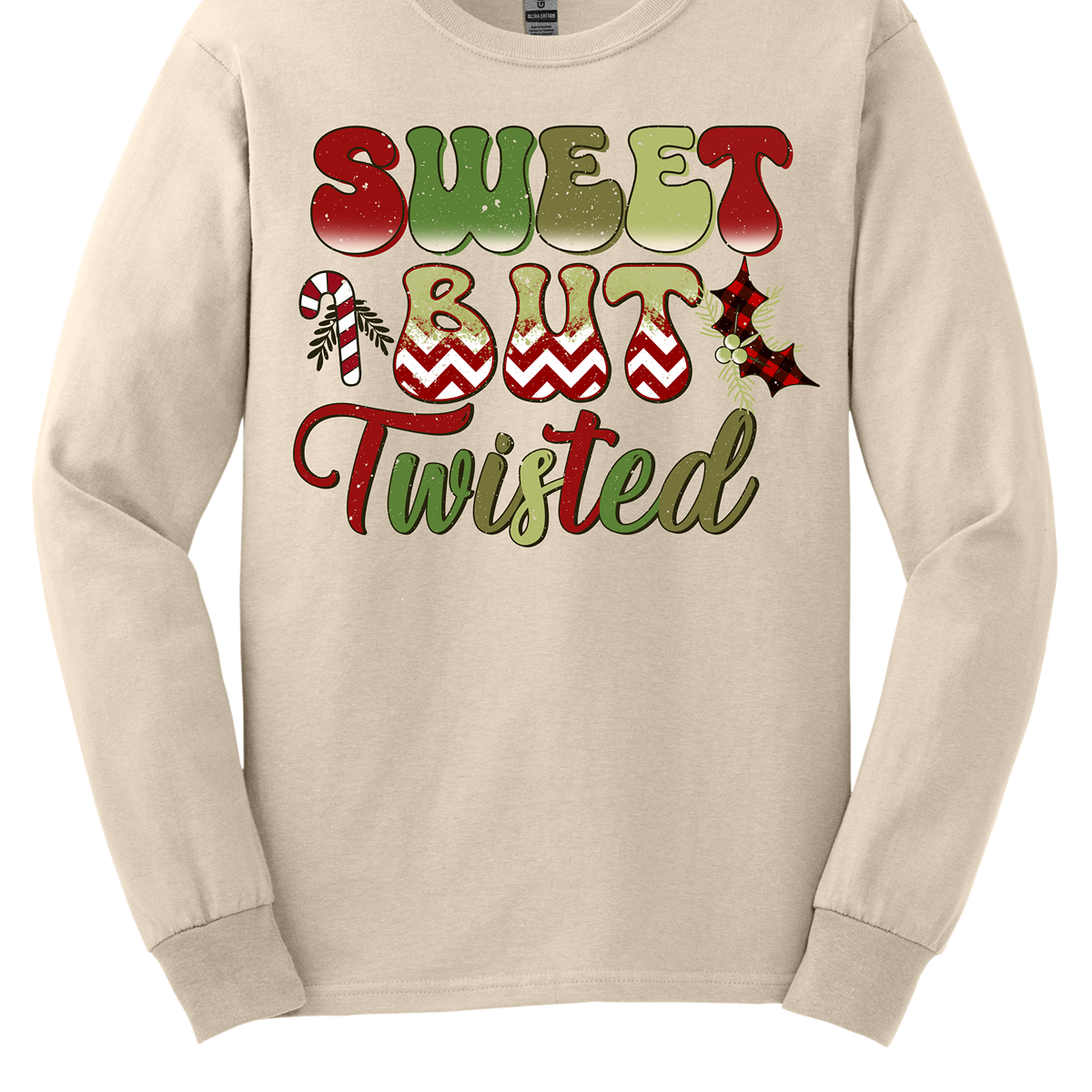 The apparel features a playful and bold design with the phrase "Sweet but Twisted" prominently displayed in large bubble letters. The letters are vibrant, with shades of green and red, creating a fun, festive contrast. The word "but" stands out, with its bottom edges filled with a red and white chevron pattern, adding a striking visual detail. Shop at Gorgeousware.com