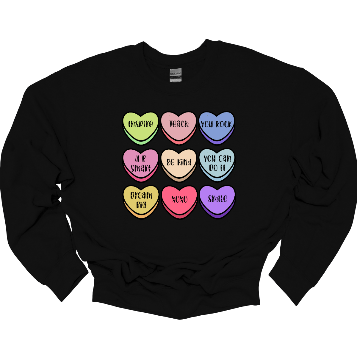 Educate your heart with our Teacher-inspired Valentine's Day T-shirt, adorned with whimsical conversation hearts. This tee is a charming blend of love and academia, featuring sweet messages like 'Inspire' and 'Teach.' The playful design celebrates the nurturing spirit of teachers with delightful phrases that reflect the classroom charm. Crafted for comfort and adorned with colorful conversation hearts, this shirt is the perfect way for educators to showcase their passion for teaching and love.