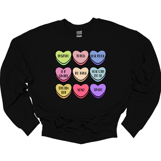 Educate your heart with our Teacher-inspired Valentine's Day T-shirt, adorned with whimsical conversation hearts. This tee is a charming blend of love and academia, featuring sweet messages like 'Inspire' and 'Teach.' The playful design celebrates the nurturing spirit of teachers with delightful phrases that reflect the classroom charm. Crafted for comfort and adorned with colorful conversation hearts, this shirt is the perfect way for educators to showcase their passion for teaching and love.