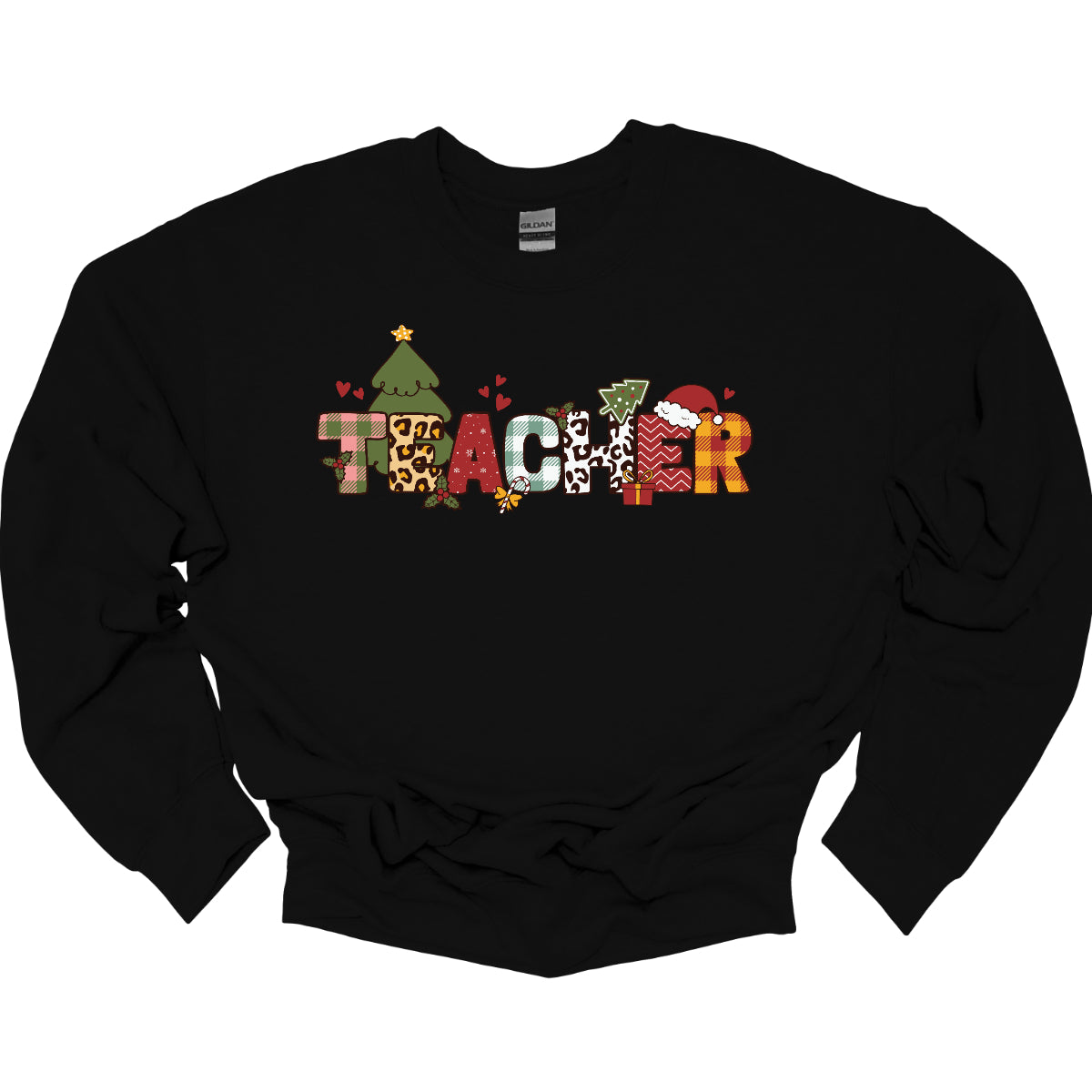 This eye-catching t-shirt boldly displays the word "TEACHER" in large block letters, each letter showcasing a unique style of print that adds a fun and creative flair. Behind the first "E," a cheerful Christmas tree adds a festive touch, while the second "E" is adorned with a cute Santa hat, making it even more playful. Shop Gorgeouswre.com