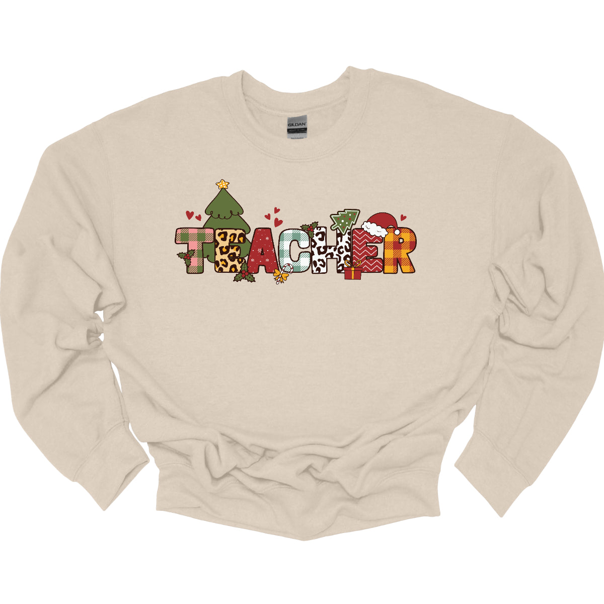 This eye-catching t-shirt boldly displays the word "TEACHER" in large block letters, each letter showcasing a unique style of print that adds a fun and creative flair. Behind the first "E," a cheerful Christmas tree adds a festive touch, while the second "E" is adorned with a cute Santa hat, making it even more playful. Shop Gorgeouswre.com