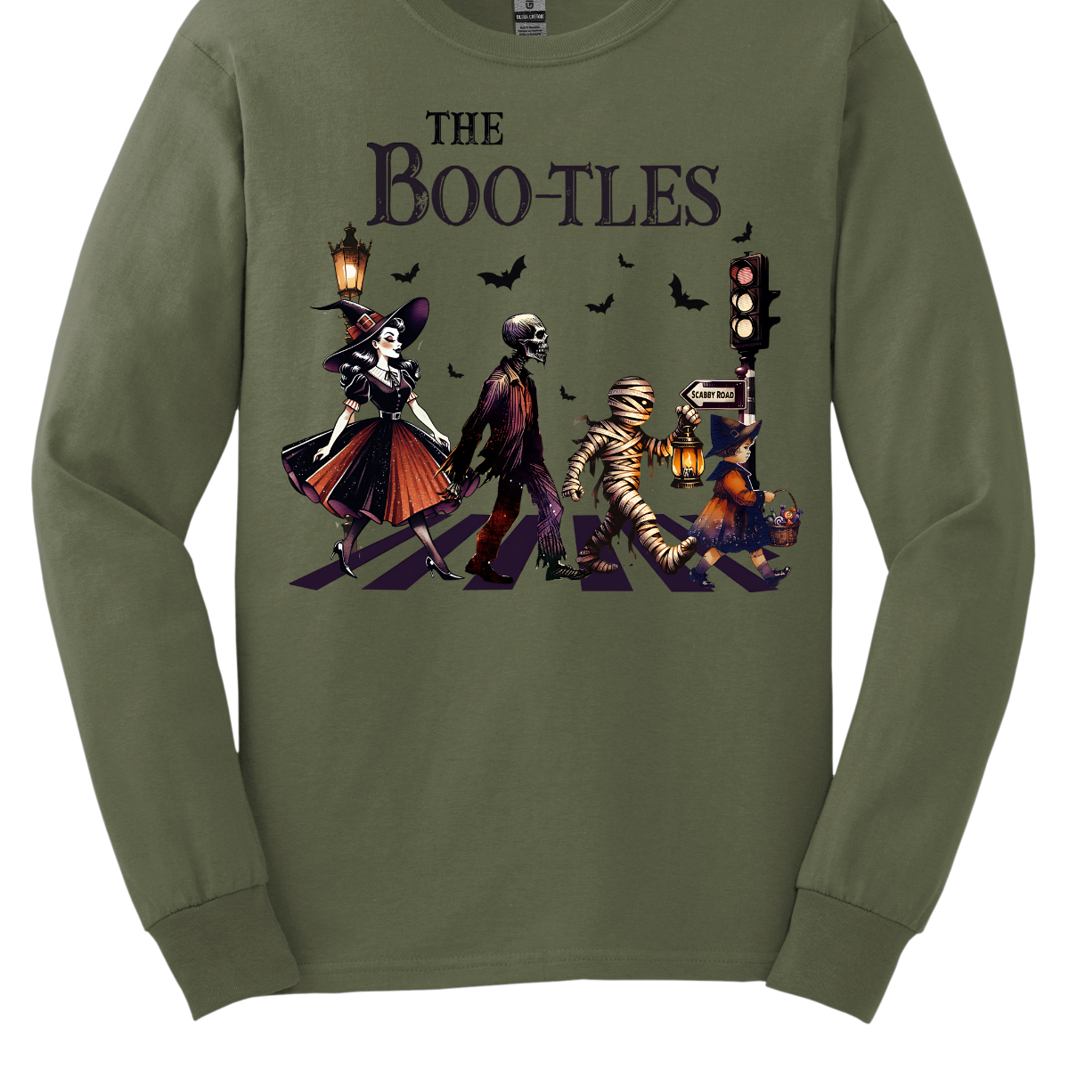 Step into a spooky twist on a classic with our 'Boot-les' tee! This Halloween-themed shirt takes inspiration from the iconic Abbey Road album cover and reimagines it with a creepy-cool lineup of Halloween characters. Picture this: a mischievous witch, a spooky skeleton, a creepy mummy, and a charming little witch, all crossing a spectral road in style. Shop at Gorgeousware.com