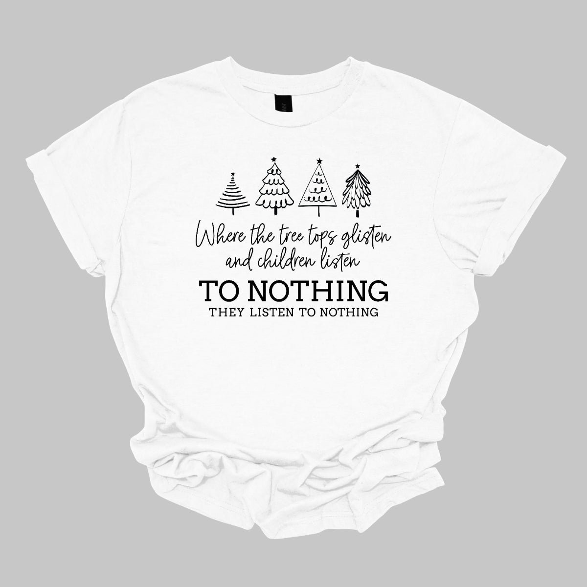 This whimsical t-shirt features the enchanting phrase "Where the tree tops glisten and the children listen" in an elegant black cursive font that flows beautifully across the fabric. Below, the words "To nothing they listen to nothing" are presented in a bold black font, creating a striking contrast. Shop Gorgeousware.com