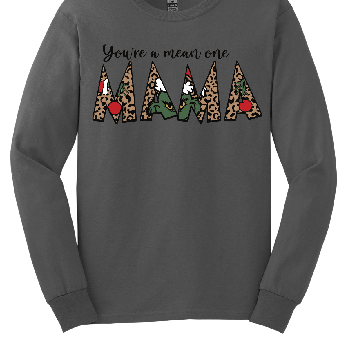 The phrase "You're a Mean One Mama" takes center stage, with "You're a Mean One" written in elegant black cursive font that flows beautifully across the fabric. The standout element is the word "Mama," which is rendered in bold, eye-catching letters. Each letter of "Mama" is filled with a quirky depiction of the Grinch, set against a vibrant cheetah print background. Shop Gorgeousware.com
