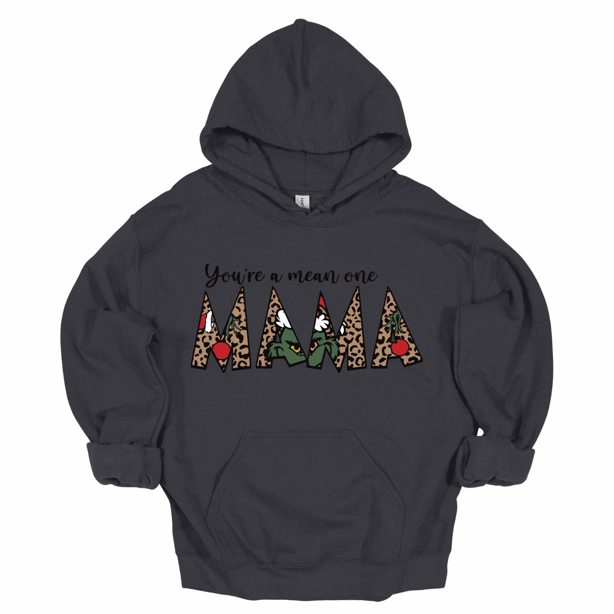 The phrase "You're a Mean One Mama" takes center stage, with "You're a Mean One" written in elegant black cursive font that flows beautifully across the fabric. The standout element is the word "Mama," which is rendered in bold, eye-catching letters. Each letter of "Mama" is filled with a quirky depiction of the Grinch, set against a vibrant cheetah print background. Shop Gorgeousware.com