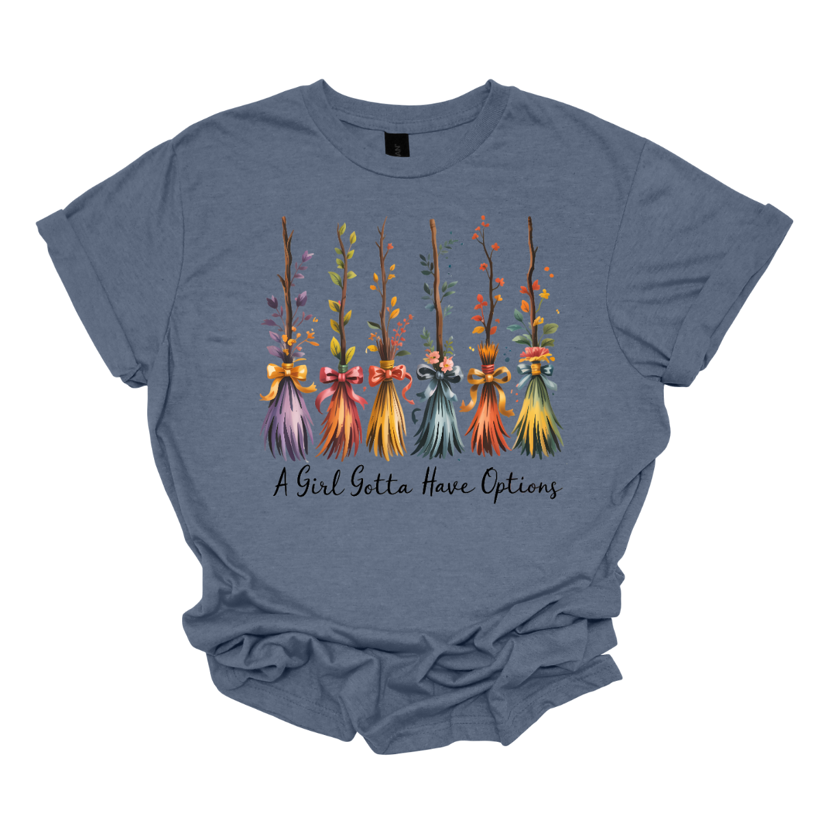 Add a little magic to your fall wardrobe with this fun and whimsical Halloween-inspired tee! The design features six wispy brooms lined up in playful autumn colors, each with its own unique charm. Beneath them, the phrase “A Girl Gotta Have Options” is written, making this shirt a cheeky and stylish nod to witchy fall vibes. Shop at Gorgeousware.com