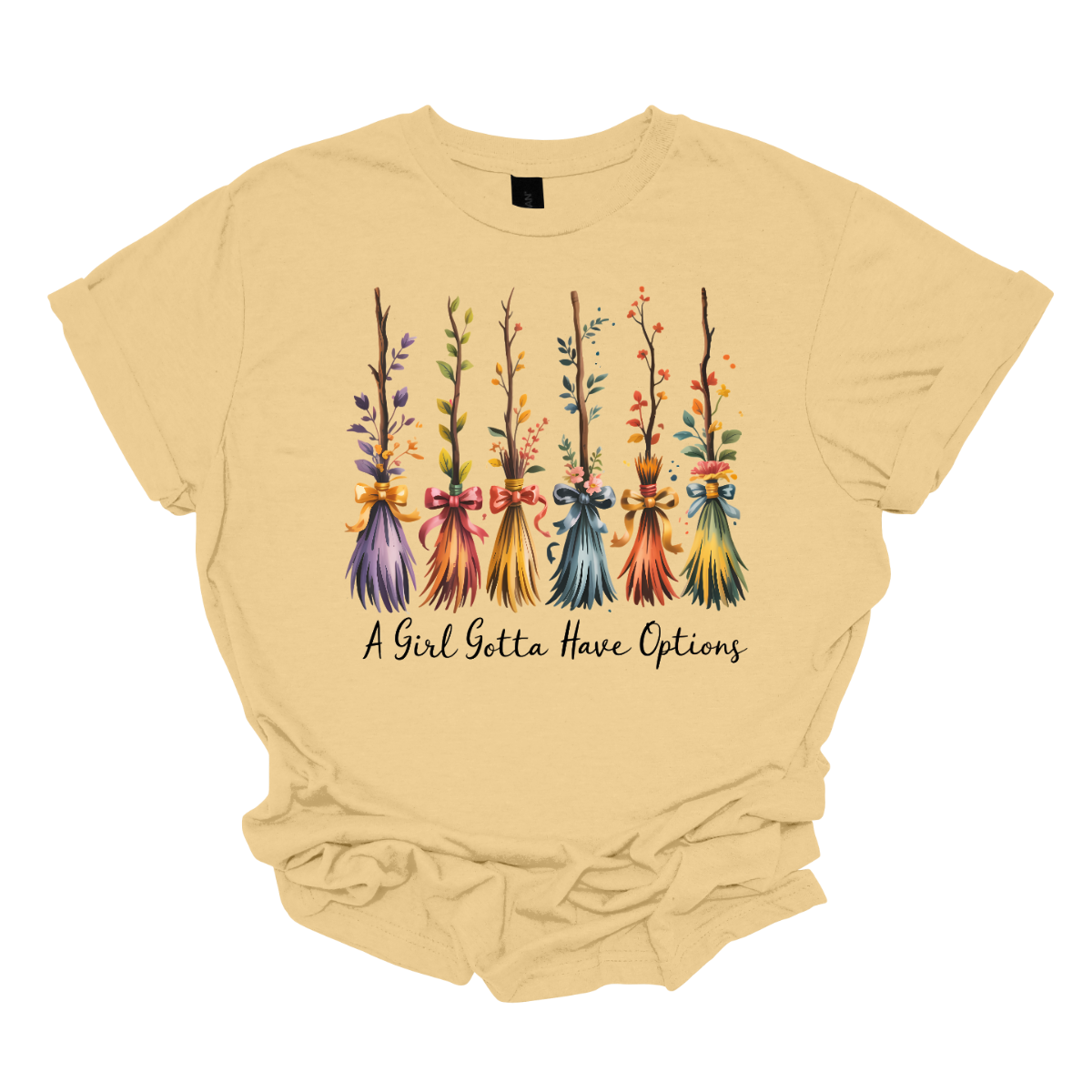 Add a little magic to your fall wardrobe with this fun and whimsical Halloween-inspired tee! The design features six wispy brooms lined up in playful autumn colors, each with its own unique charm. Beneath them, the phrase “A Girl Gotta Have Options” is written, making this shirt a cheeky and stylish nod to witchy fall vibes. Shop at Gorgeousware.com