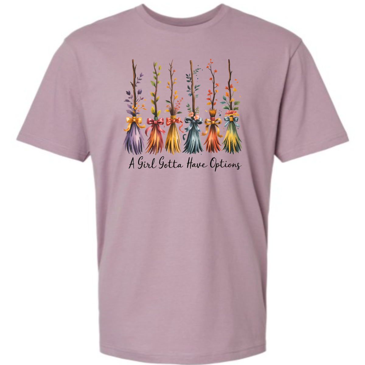 Add a little magic to your fall wardrobe with this fun and whimsical Halloween-inspired tee! The design features six wispy brooms lined up in playful autumn colors, each with its own unique charm. Beneath them, the phrase “A Girl Gotta Have Options” is written, making this shirt a cheeky and stylish nod to witchy fall vibes. Shop at Gorgeousware.com