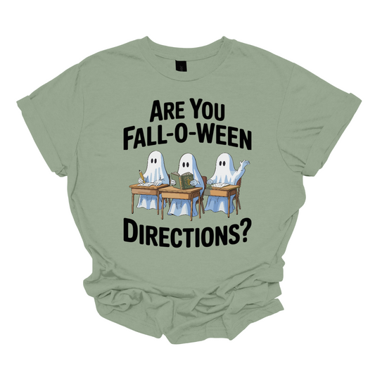 Bring some spooky fun into the classroom (or your everyday fall style) with this adorable Halloween graphic tee! 🎃👻 The design features three cute ghosts sitting at student desks — one writing with a pencil, one reading a book, and one raising their hand — paired with the playful phrase “Are you Fall-O-Ween Directions?” Shop at Gorgeousware.com