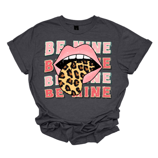 Rock your romantic style with our 'Be Mine' T-shirt featuring the iconic Rolling Stones-inspired mouth design. This tee brings together timeless romance and classic rock aesthetics, creating a bold and edgy statement for the modern romantic. The distinctive open-mouth graphic adds a touch of rebellious charm to the traditional 'Be Mine' message.