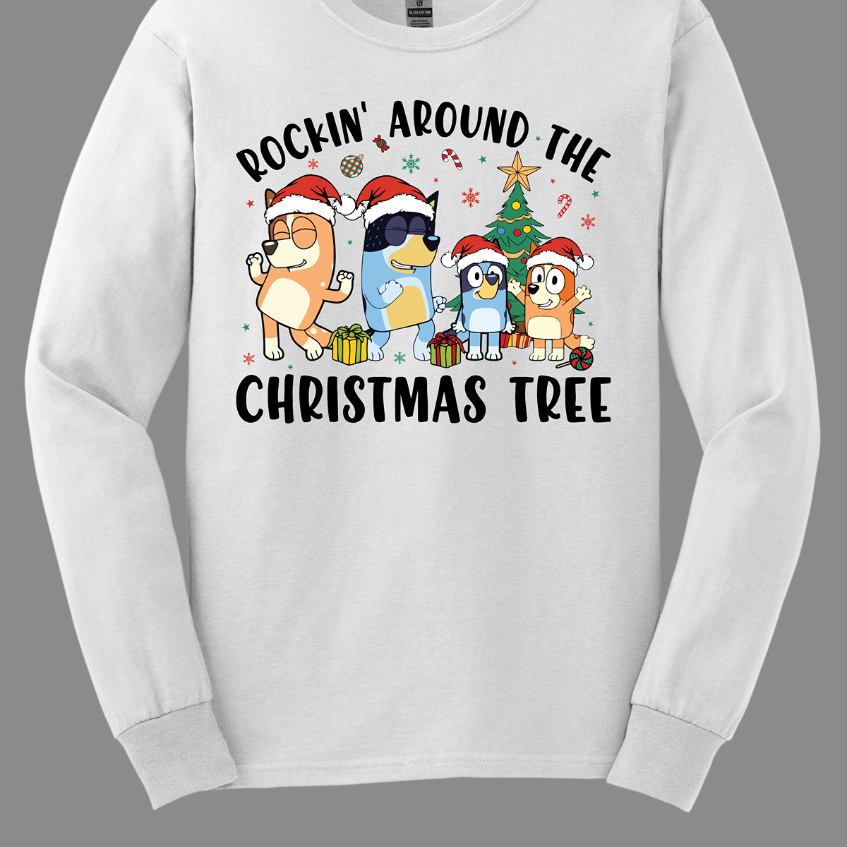 Celebrate the festive season with Bluey and her family in this heartwarming design! The beloved Bluey and her family are gathered around a beautifully decorated Christmas tree, joyfully rocking around the holiday cheer. The playful scene is filled with bright colors, festive ornaments, twinkling lights, and the spirit of togetherness. The phrase "Rockin' Around the Christmas Tree" arches over the design, capturing the fun and excitement of the holidays.