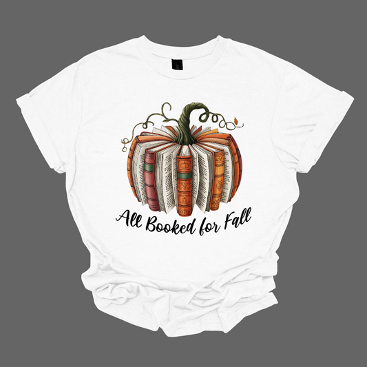 Cozy up this fall with our Booked for Fall tee — the perfect blend of autumn charm and bookworm style! This unique design features a pumpkin made entirely from stacked books, alternating forward and backward to create a whimsical literary pumpkin. At the bottom it says "All Booked for Fall". Shop at Gorgeousware.com